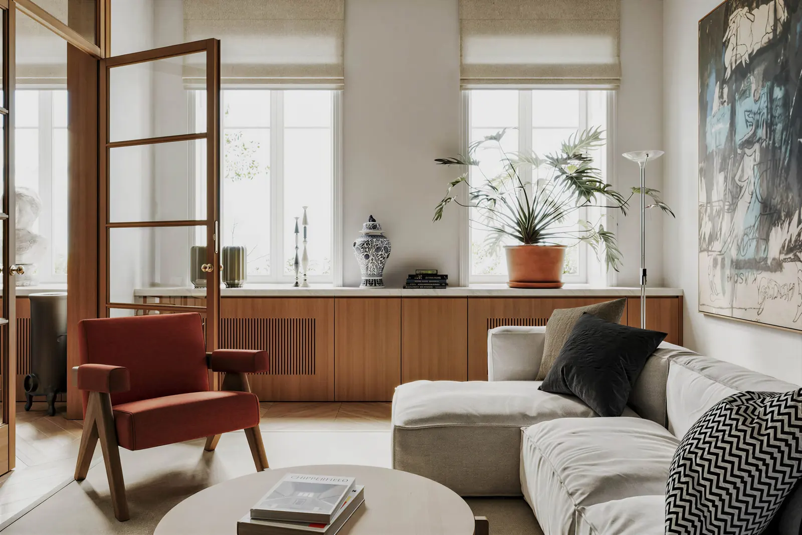 Living room with a red armchair and glass partition. Tiong Bahru, 3-room HDB · Tiong Bahru, renovation by ELEVATED.